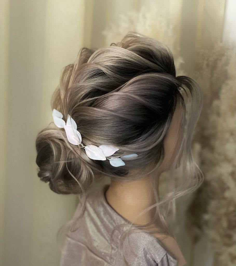 updo hairstyle with leafs